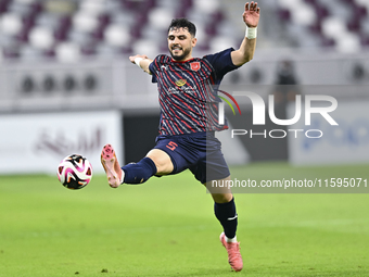 Bassam Hisham of Al Duhail SC plays in the Ooredoo Qatar Stars League 24/25 match between Al-Sadd SC and Al Duhail SC at Khalifa Internation...