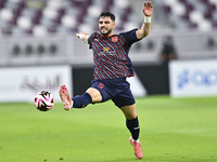 Bassam Hisham of Al Duhail SC plays in the Ooredoo Qatar Stars League 24/25 match between Al-Sadd SC and Al Duhail SC at Khalifa Internation...