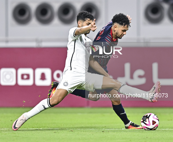 Abdulla Badr Alyazidi (L) of Al-Sadd SC battles for the ball with Edmilson Junior Paulo (R) of Duhail SC during the Ooredoo Qatar Stars Leag...