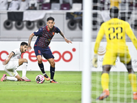 Abdulla Badr Alyazidi (L) of Al-Sadd SC battles for the ball with Edmilson Junior Paulo (R) of Duhail SC during the Ooredoo Qatar Stars Leag...