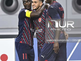 Edmilson Junior Paulo (C) of Al Duhail SC celebrates after scoring a goal during the Ooredoo Qatar Stars League 24/25 match between Al-Sadd...