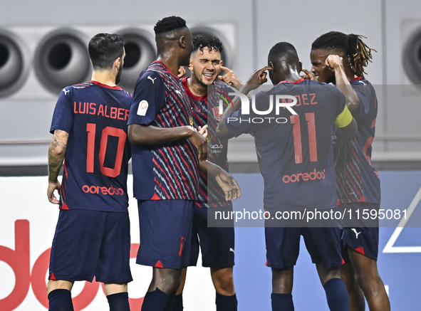 Edmilson Junior Paulo (C) of Al Duhail SC celebrates after scoring a goal during the Ooredoo Qatar Stars League 24/25 match between Al-Sadd...