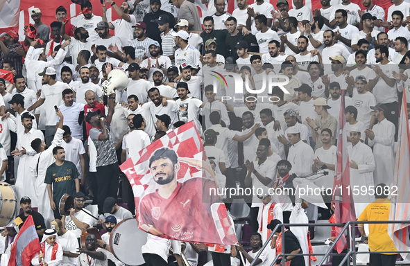 Fans of Al Duhail SC cheer for their team during the Ooredoo Qatar Stars League 24/25 match between Al-Sadd SC and Al Duhail SC at Khalifa I...