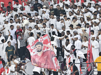 Fans of Al Duhail SC cheer for their team during the Ooredoo Qatar Stars League 24/25 match between Al-Sadd SC and Al Duhail SC at Khalifa I...