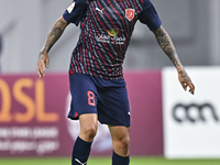 Edmilson Junior Paulo of Al Duhail SC plays in the Ooredoo Qatar Stars League 24/25 match between Al-Sadd SC and Al Duhail SC at Khalifa Int...