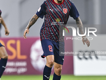 Edmilson Junior Paulo of Al Duhail SC plays in the Ooredoo Qatar Stars League 24/25 match between Al-Sadd SC and Al Duhail SC at Khalifa Int...