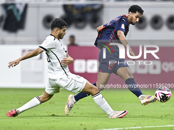 Abdulla Badr Alyazidi (L) of Al-Sadd SC battles for the ball with Homam El Amin (R) during the Ooredoo Qatar Stars League 24/25 match betwee...