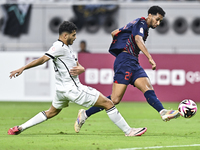 Abdulla Badr Alyazidi (L) of Al-Sadd SC battles for the ball with Homam El Amin (R) during the Ooredoo Qatar Stars League 24/25 match betwee...