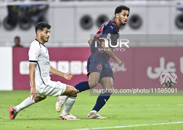 Abdulla Badr Alyazidi (L) of Al-Sadd SC battles for the ball with Homam El Amin (R) during the Ooredoo Qatar Stars League 24/25 match betwee...