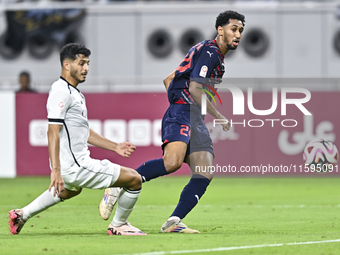 Abdulla Badr Alyazidi (L) of Al-Sadd SC battles for the ball with Homam El Amin (R) during the Ooredoo Qatar Stars League 24/25 match betwee...