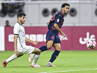 Abdulla Badr Alyazidi (L) of Al-Sadd SC battles for the ball with Homam El Amin (R) during the Ooredoo Qatar Stars League 24/25 match betwee...