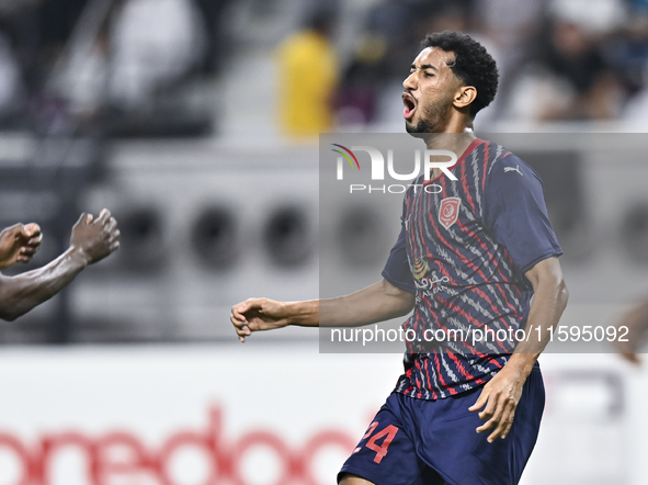 Homam El Amin of Al Duhail SC celebrates after scoring a goal during the Ooredoo Qatar Stars League 24/25 match between Al-Sadd SC and Al Du...