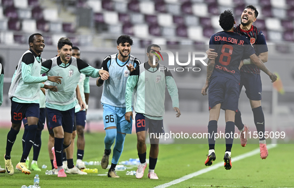 Edmilson Junior Paulo (2-R) of Al Duhail SC celebrates after scoring the second goal during the Ooredoo Qatar Stars League 24/25 match betwe...