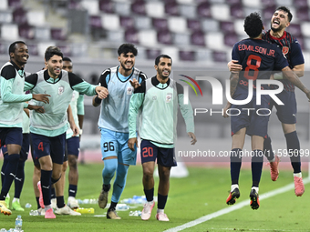 Edmilson Junior Paulo (2-R) of Al Duhail SC celebrates after scoring the second goal during the Ooredoo Qatar Stars League 24/25 match betwe...