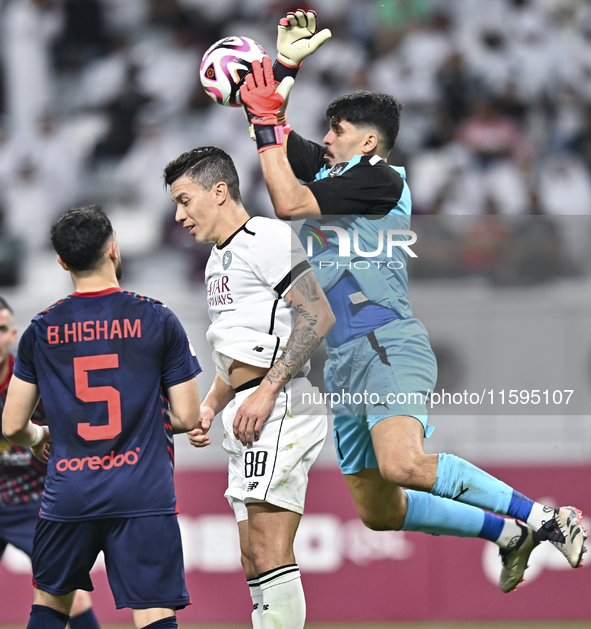 Andres Villa (C) of Al-Sadd SC battles for the ball with Salah Zachariah (R) of Duhail SC during the Ooredoo Qatar Stars League 24/25 match...