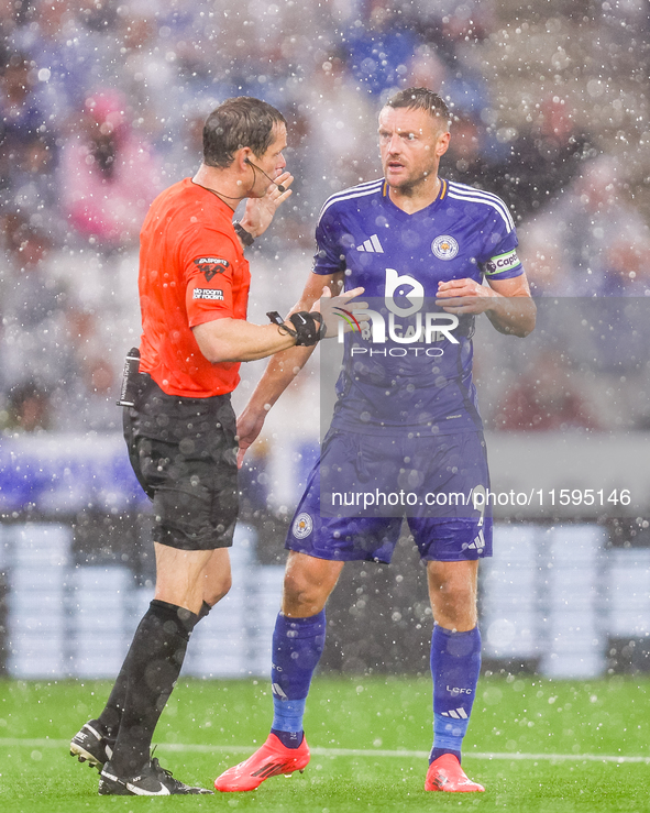 Referee Darren England speaks to #9, Jamie Vardy of Leicester City during the Premier League match between Leicester City and Everton at the...