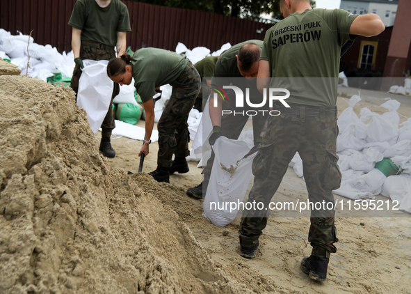 Soldiers from the 1st Brzeg Sapper Regiment prepare sandbags during flooding due to the Odra River flooding in Brzeg, Poland, on September 1...