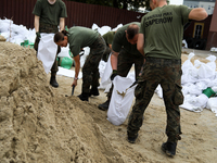 Soldiers from the 1st Brzeg Sapper Regiment prepare sandbags during flooding due to the Odra River flooding in Brzeg, Poland, on September 1...