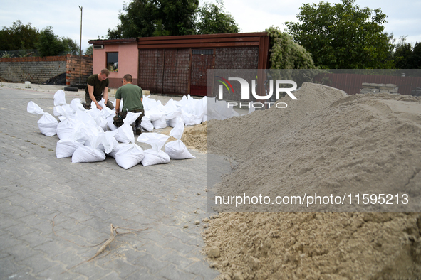 Soldiers from the 1st Brzeg Sapper Regiment prepare sandbags during flooding due to the Odra River flooding in Brzeg, Poland, on September 1...