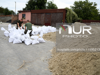 Soldiers from the 1st Brzeg Sapper Regiment prepare sandbags during flooding due to the Odra River flooding in Brzeg, Poland, on September 1...