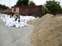 Soldiers from the 1st Brzeg Sapper Regiment prepare sandbags during flooding due to the Odra River flooding in Brzeg, Poland, on September 1...