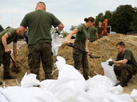 Soldiers from the 1st Brzeg Sapper Regiment prepare sandbags during flooding due to the Odra River flooding in Brzeg, Poland, on September 1...