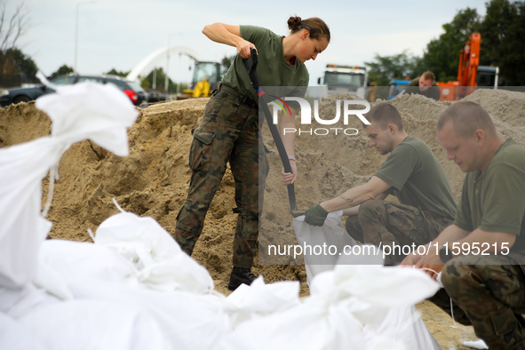 Soldiers from the 1st Brzeg Sapper Regiment prepare sandbags during flooding due to the Odra River flooding in Brzeg, Poland, on September 1...