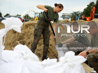 Soldiers from the 1st Brzeg Sapper Regiment prepare sandbags during flooding due to the Odra River flooding in Brzeg, Poland, on September 1...