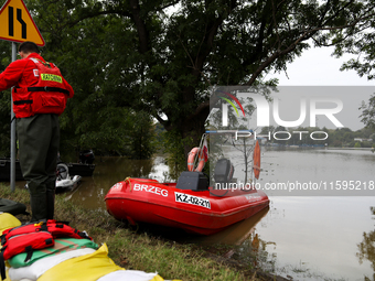 A rescuer with a motorboat in flooded areas of the city during flooding and the Odra River flooding in Brzeg, Poland, on September 19, 2023....