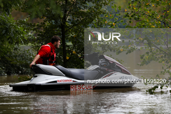 A rescuer with a motorboat in flooded areas of the city during flooding and the Odra River flooding in Brzeg, Poland, on September 19, 2023....