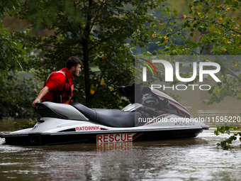 A rescuer with a motorboat in flooded areas of the city during flooding and the Odra River flooding in Brzeg, Poland, on September 19, 2023....