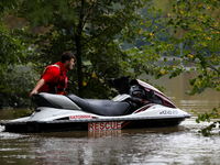 A rescuer with a motorboat in flooded areas of the city during flooding and the Odra River flooding in Brzeg, Poland, on September 19, 2023....