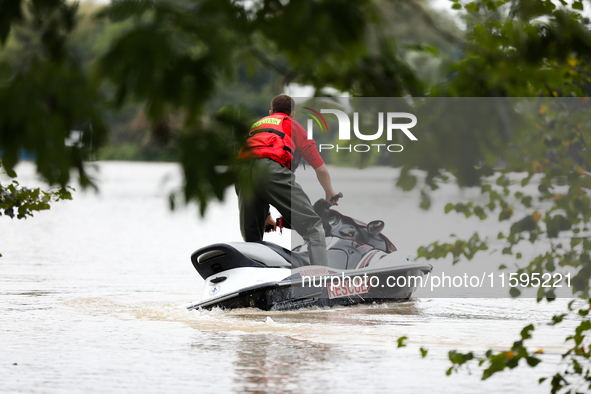 A rescuer with a motorboat in flooded areas of the city during flooding and the Odra River flooding in Brzeg, Poland, on September 19, 2023....