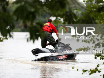 A rescuer with a motorboat in flooded areas of the city during flooding and the Odra River flooding in Brzeg, Poland, on September 19, 2023....