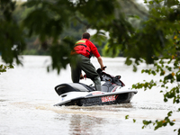 A rescuer with a motorboat in flooded areas of the city during flooding and the Odra River flooding in Brzeg, Poland, on September 19, 2023....