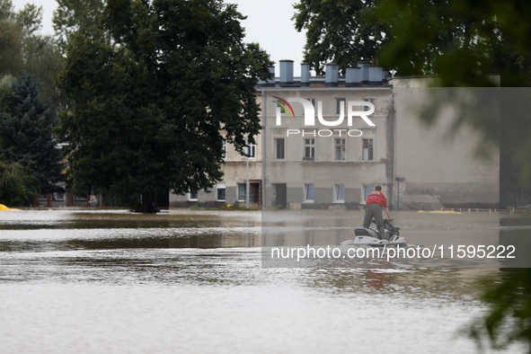 A rescuer with a motorboat in flooded areas of the city during flooding and the Odra River flooding in Brzeg, Poland, on September 19, 2023....