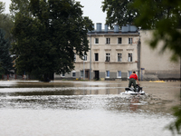 A rescuer with a motorboat in flooded areas of the city during flooding and the Odra River flooding in Brzeg, Poland, on September 19, 2023....