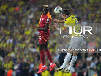 Victor Osimhen of Galatasaray and Dominik Livakovic of Fenerbahce battle for the ball during the Turkey Süper Ligue Round 5 between Fenerbah...