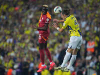 Victor Osimhen of Galatasaray and Dominik Livakovic of Fenerbahce battle for the ball during the Turkey Süper Ligue Round 5 between Fenerbah...