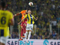 Abdülkerim Bardakcı of Galatasaray and Sebastian Szymański of Fenerbahce battle for the ball during the Turkey Süper Ligue Round 5 between F...