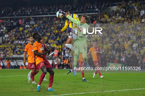 Youssef En-Nesyri of Fenerbahce and Fernando Muslera of Galatasaray battle for the ball during the Turkey Süper Ligue Round 5 between Fenerb...