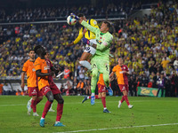 Youssef En-Nesyri of Fenerbahce and Fernando Muslera of Galatasaray battle for the ball during the Turkey Süper Ligue Round 5 between Fenerb...