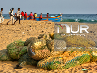 Fishing nets by the ocean along Paruthiyoor Beach in Paruthiyoor, Kerala, India, on April 15, 2024. (