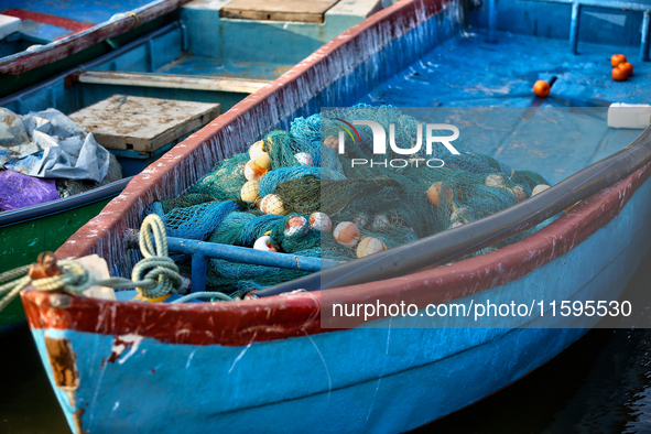 Fishing boats are in the ocean along Paruthiyoor Beach in Paruthiyoor, Kerala, India, on April 15, 2024. 