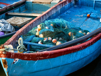 Fishing boats are in the ocean along Paruthiyoor Beach in Paruthiyoor, Kerala, India, on April 15, 2024. (