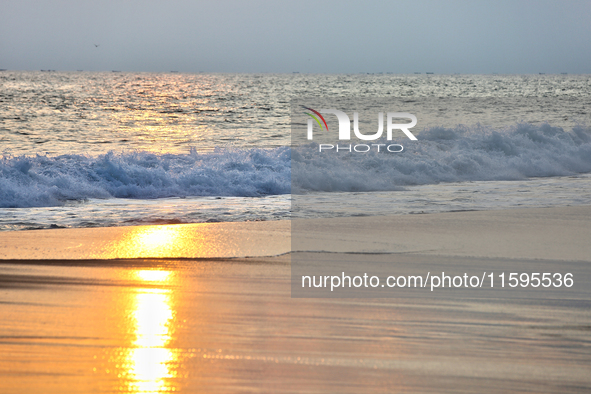 Sunset occurs along Paruthiyoor Beach in Paruthiyoor, Kerala, India, on April 15, 2024. 