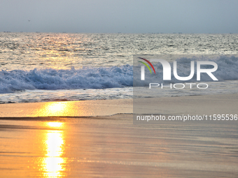 Sunset occurs along Paruthiyoor Beach in Paruthiyoor, Kerala, India, on April 15, 2024. (