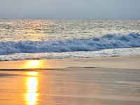 Sunset occurs along Paruthiyoor Beach in Paruthiyoor, Kerala, India, on April 15, 2024. (