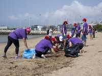 Several volunteers collect waste and garbage during a beach cleanup day in the municipality of Alges in Lisbon, Portugal, on September 21, 2...