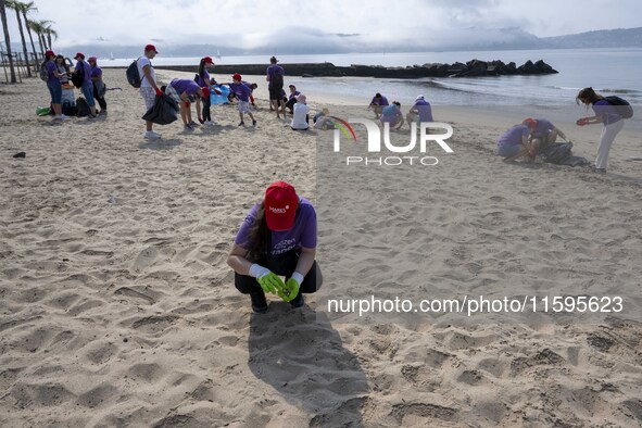 Several volunteers collect waste and garbage during a beach cleanup day in the municipality of Alges in Lisbon, Portugal, on September 21, 2...